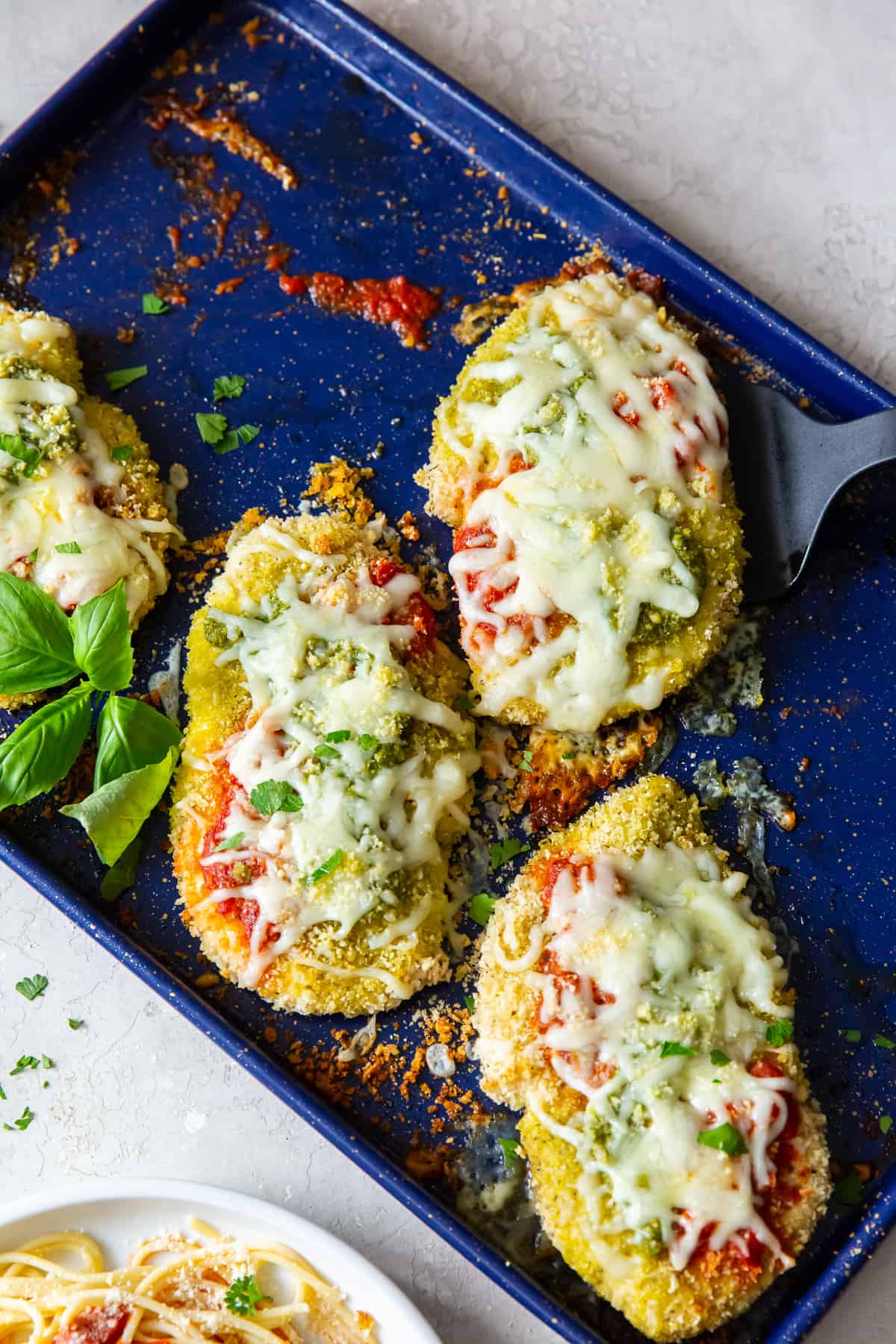 Chicken Parmesan with pesto sauce
